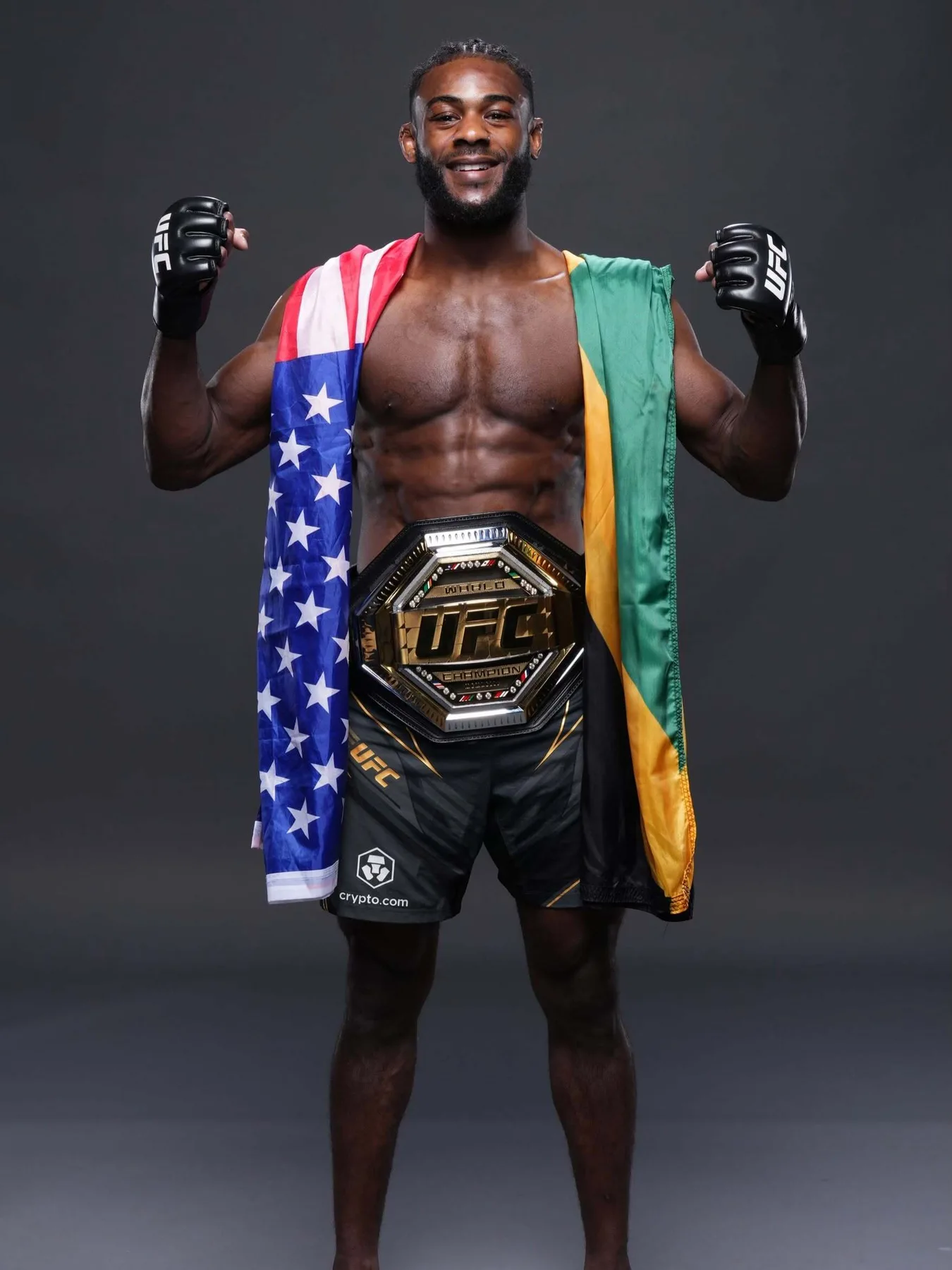Aljamain Sterling wearing the UFC championship belt